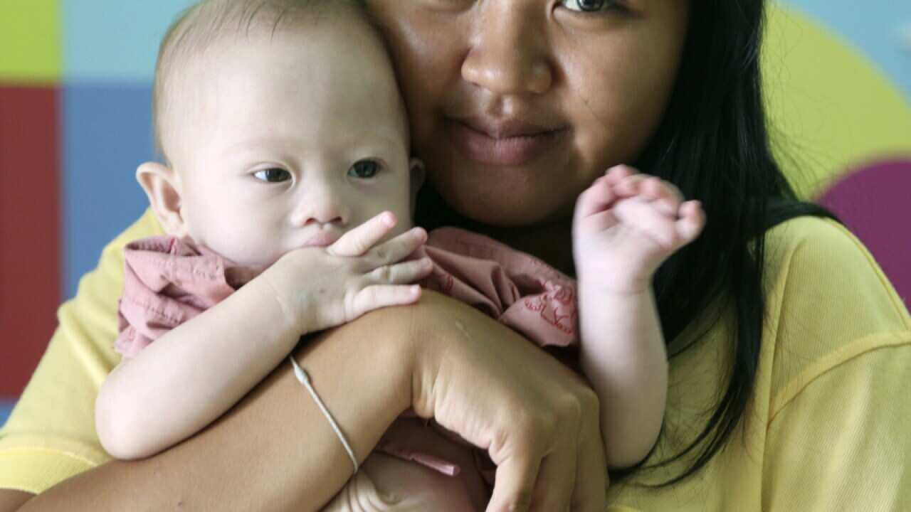 Pattaramon Chanbua, 21, poses her baby boy Gammy