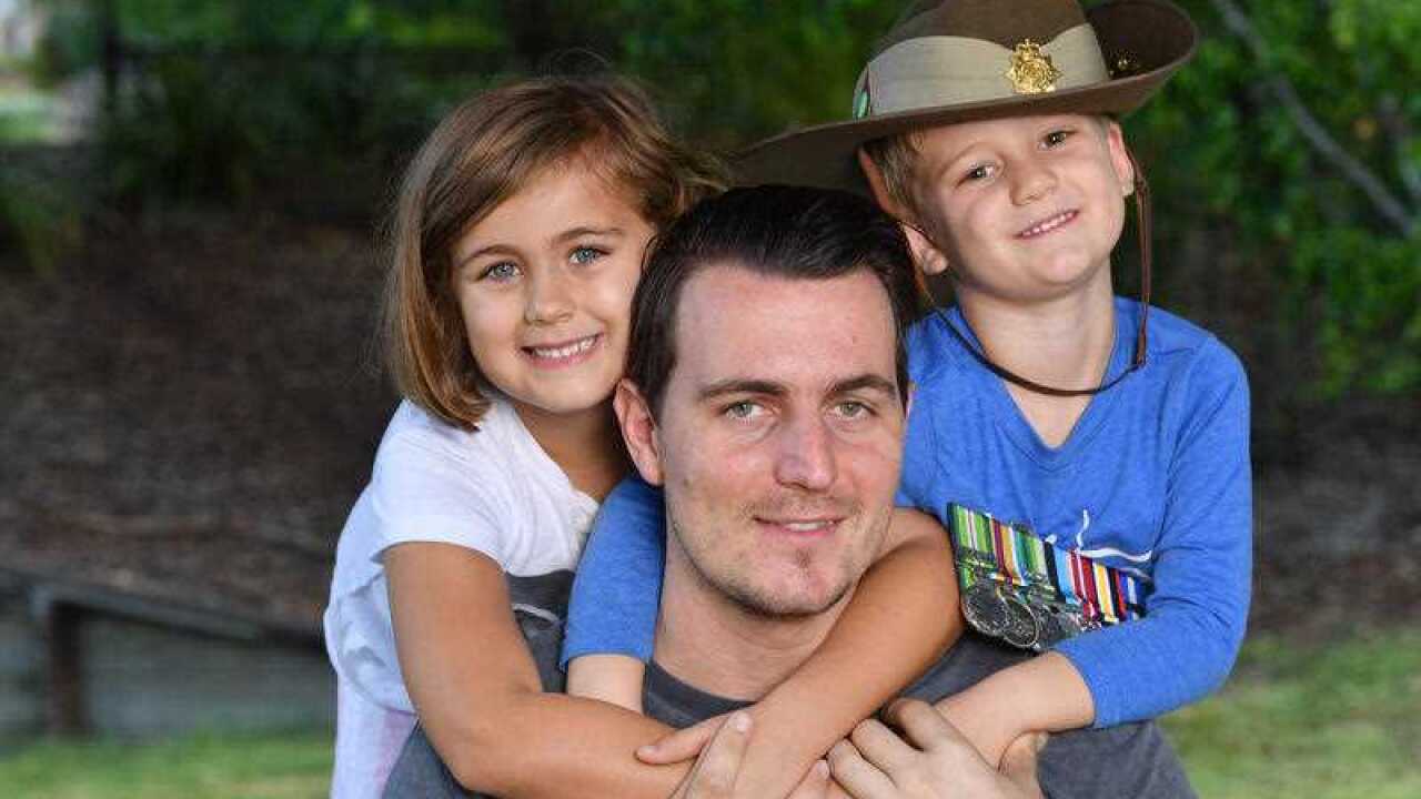 Former Australian Army medic James DeAngelis with his children Ava (left) and Harry. The former Corporal has recently made the jump to civilian life.