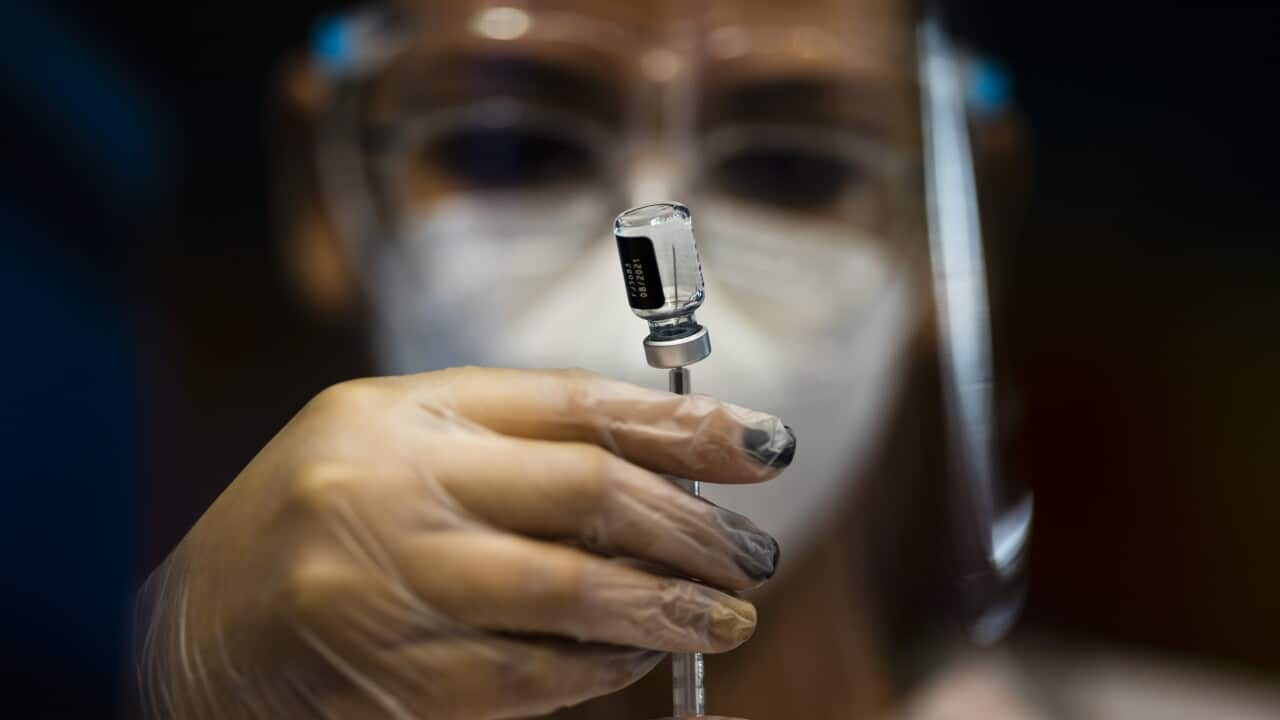 A nurse preparing a vaccine