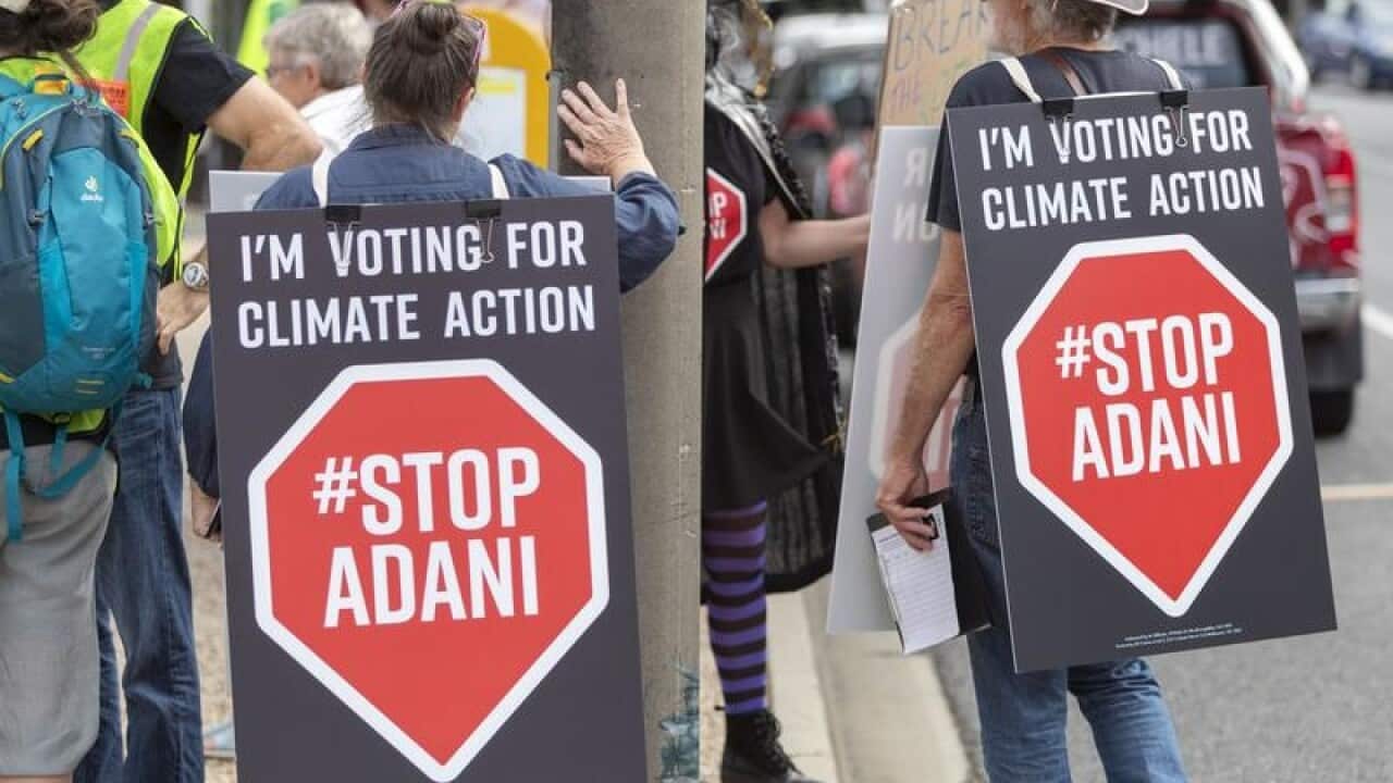 Climate change protestors are seen in Brisbane.