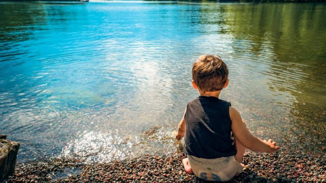Boy by lake