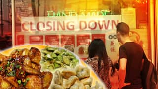 A dish of eggplant, and diners looking at a shop window