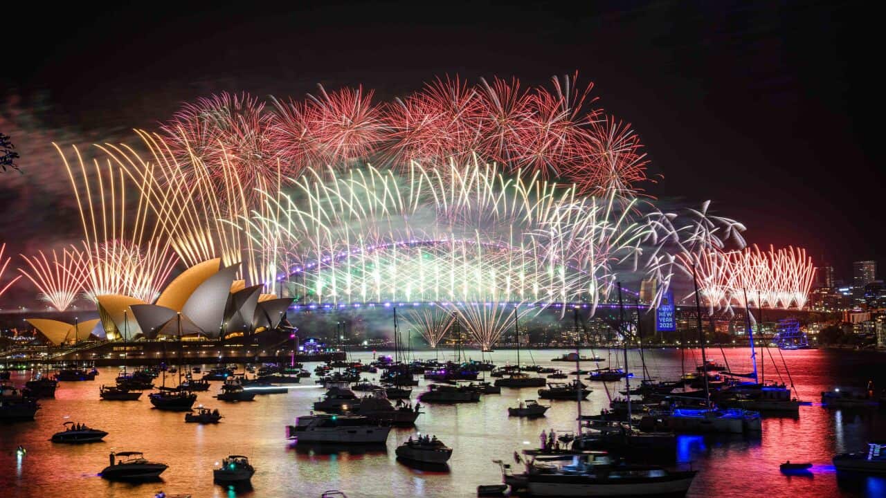 Fireworks are seen over the Sydney Opera House and Harbour Bridge during New Year’s Eve celebration