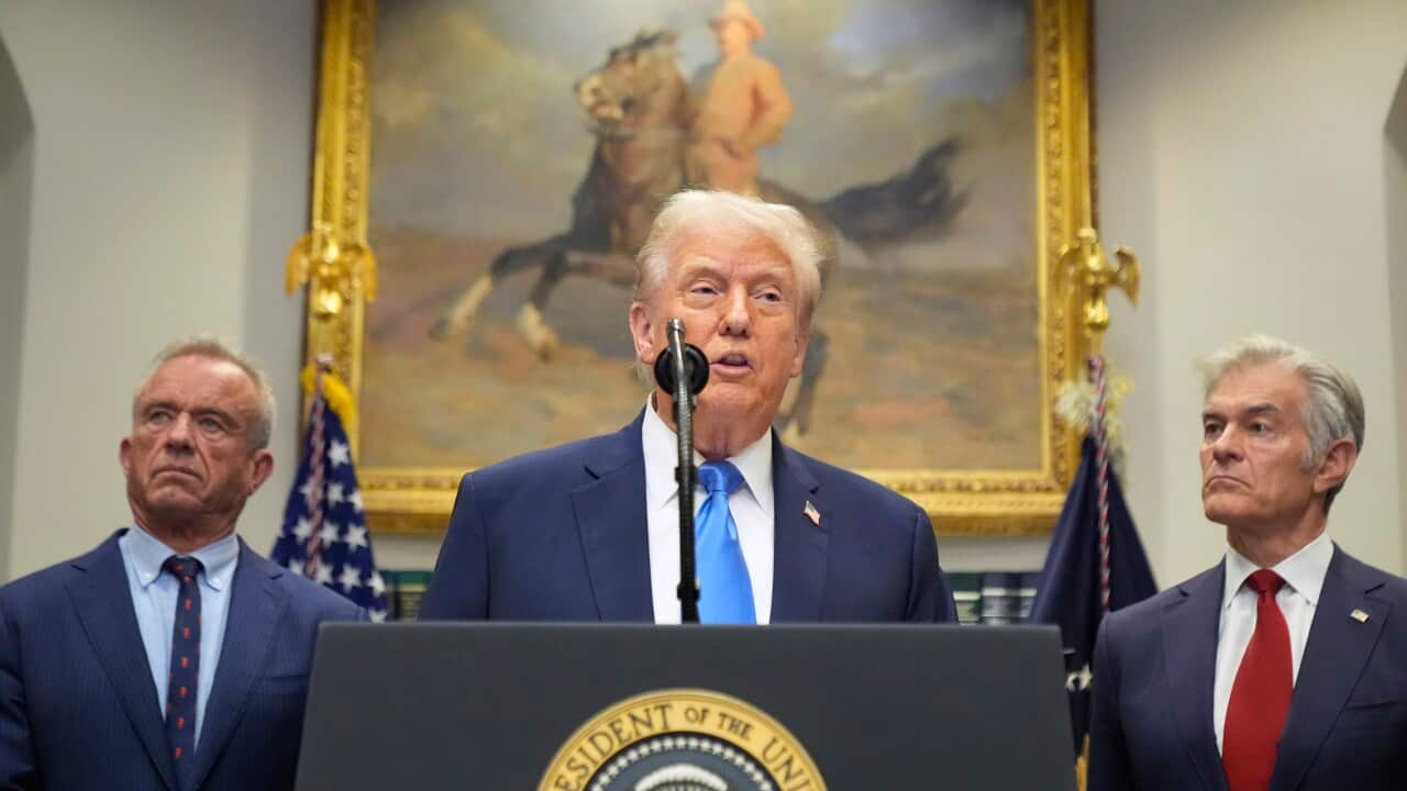 President Donald Trump speaks in the Roosevelt Room of the White House, Monday, Sept. 22, 2025, in Washington, as Health and Human Services Secretary Robert F. Kennedy Jr., left, and Centers for Medicare & Medicaid Services administrator Dr. Mehmet Oz listen