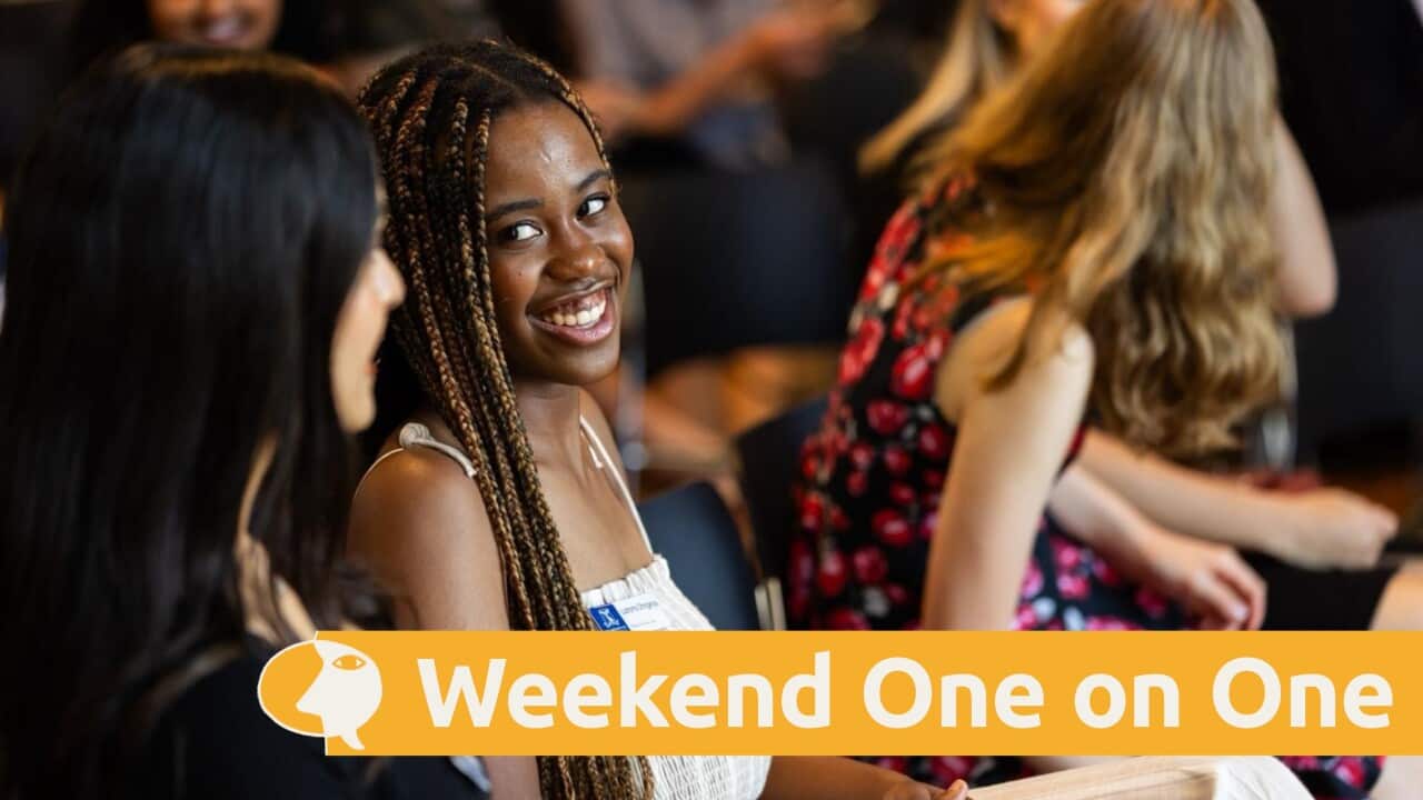 Lushy Chinganya speaks to a fellow student.