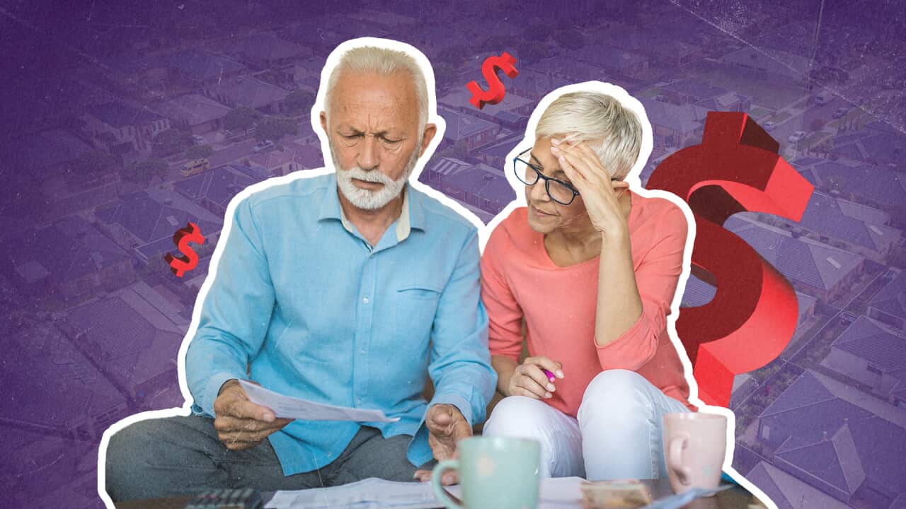 Graphic of two senior Australians looking at a paper with a confused look. The purple background features three red dollar signs.