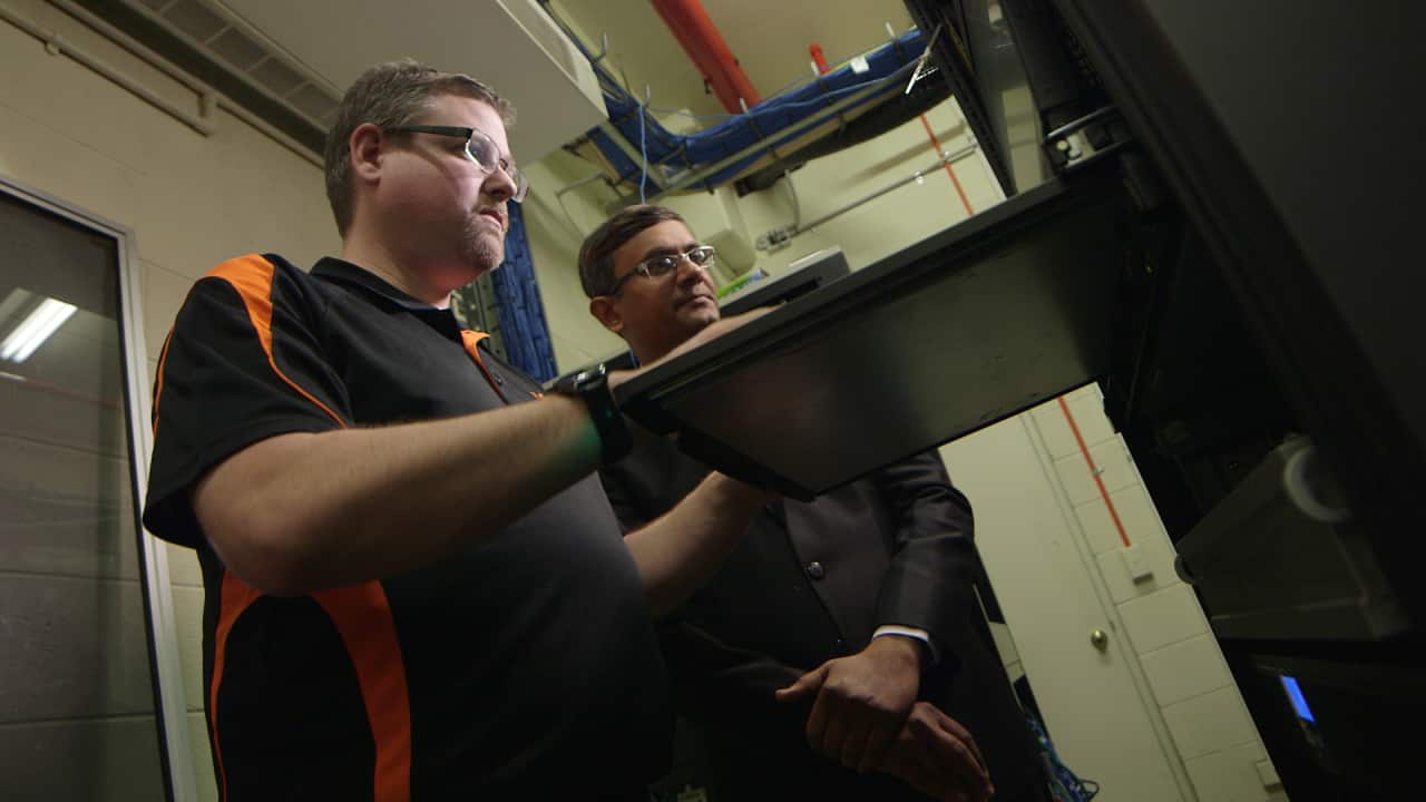 Geek's  senior network engineer Andrew Huxtable with client Bhavin Patel.