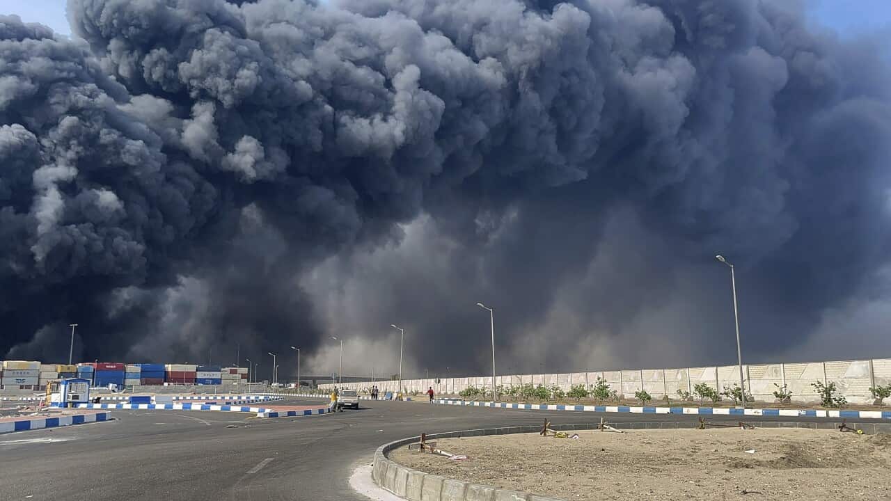 Black smoke in an industrial area.