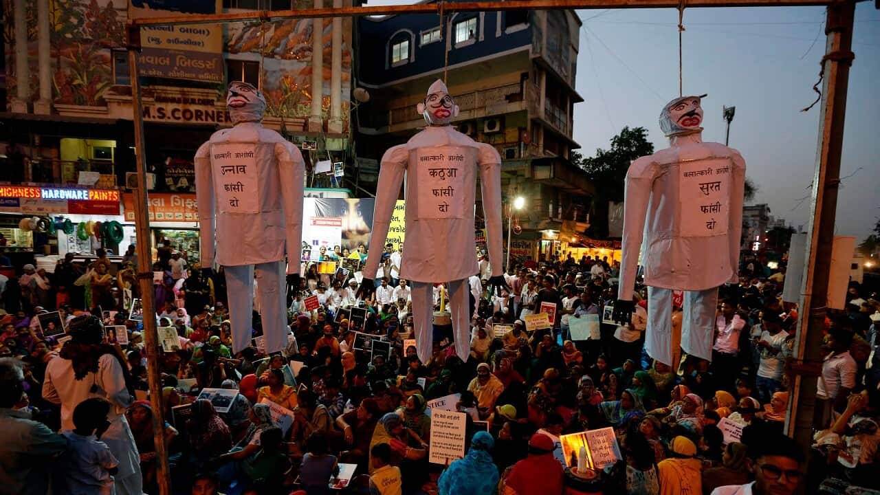 effigies hang on nooses with the words, "hang the guilty in the Unnao rape case," "Hang the guilty in Kathua rape case," "hang the guilty in Surat rape case,