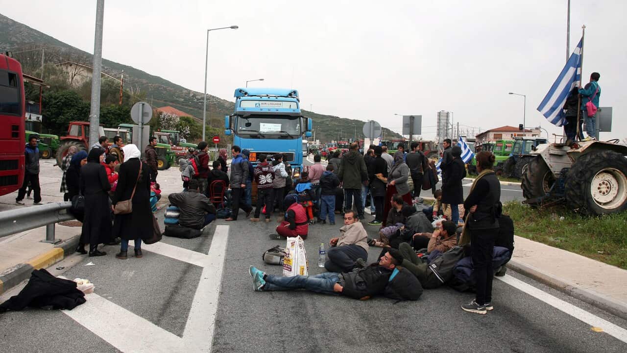 Migrants and refugees protest on the Athens-Thessaloniki motorway kept closed by protesting farmers for the last 17 days.