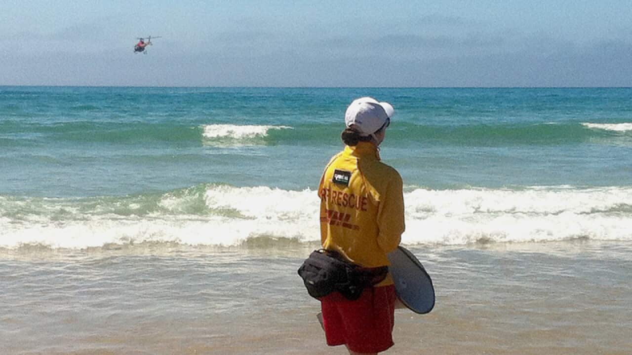 A helicopter chases a shark from Loutit Bay in Melbourne