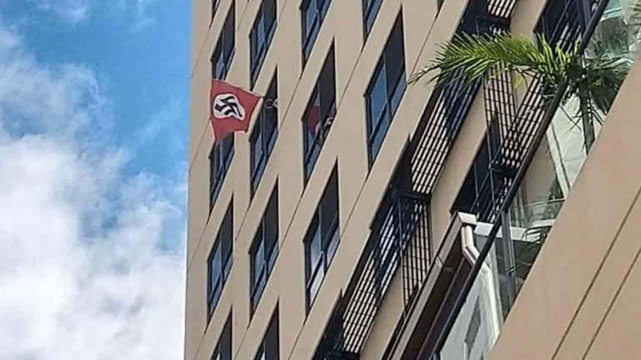 Swastika flag displayed from a window of a building neighbouring a Brisbane synagogue on Margaret Street