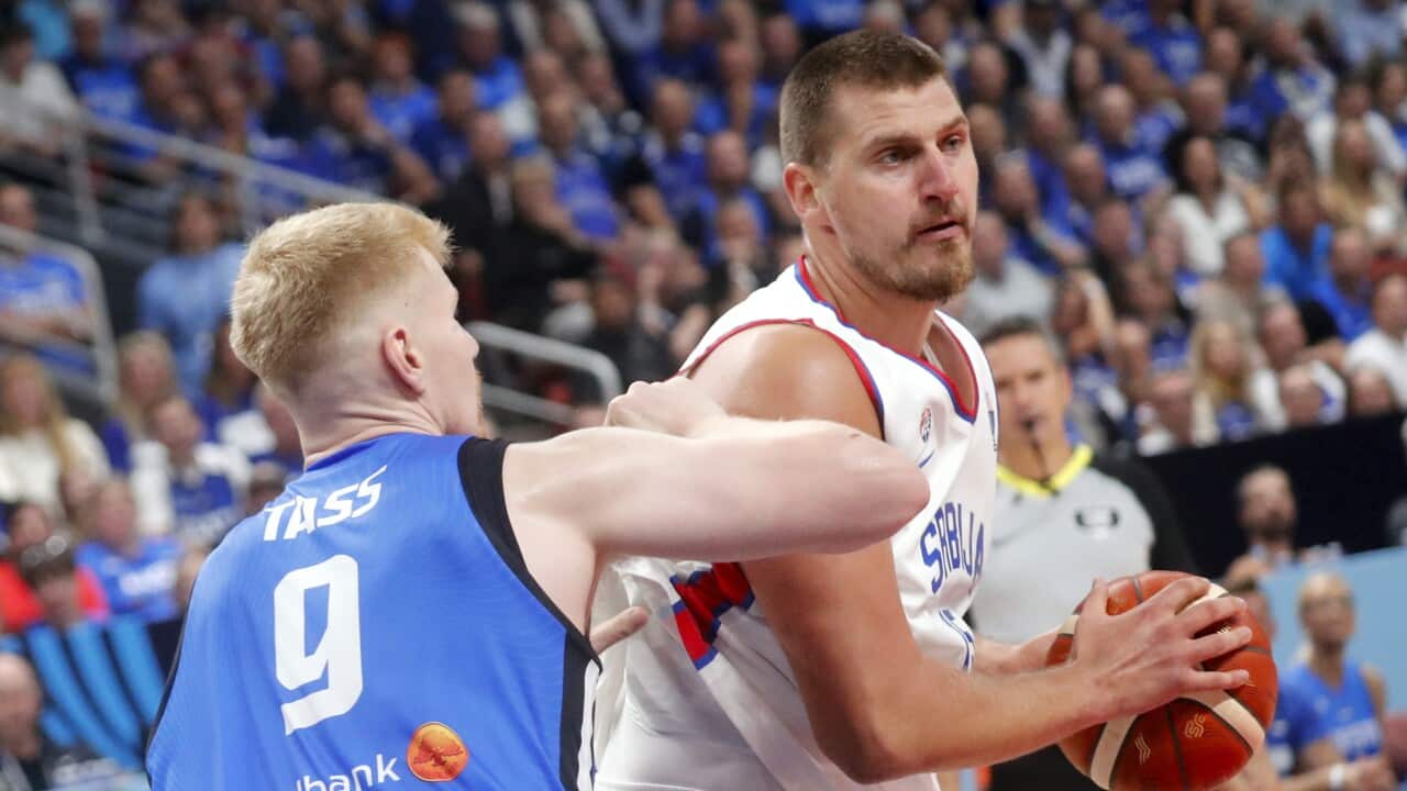 Nikola Jokic (R) of Serbia and Matthias Tass of Estonia in action during the EuroBasket 2025 group phase basketball match between Serbia and Estonia, in Riga