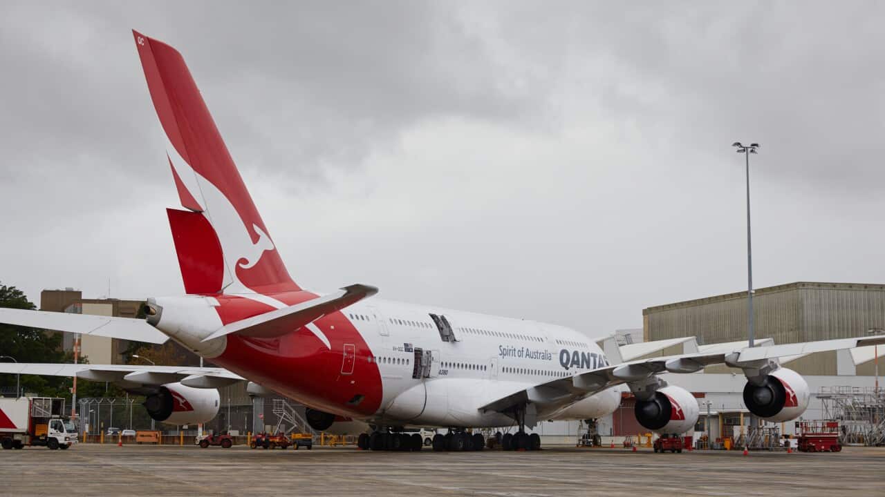 A Qantas plane parked at Sydney Airport.
