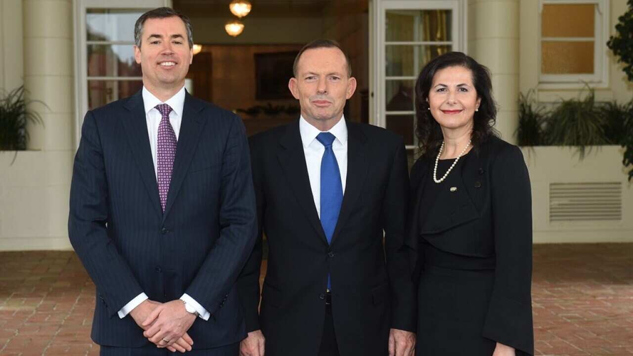 Federal Minister for Justice Michael Keenan, Prime Minister Tony Abbott and Federal Liberal Senator Concetta Fierravanti-Wells pose for photos at Government House in Canberra, Thursday, May 28, 2015.