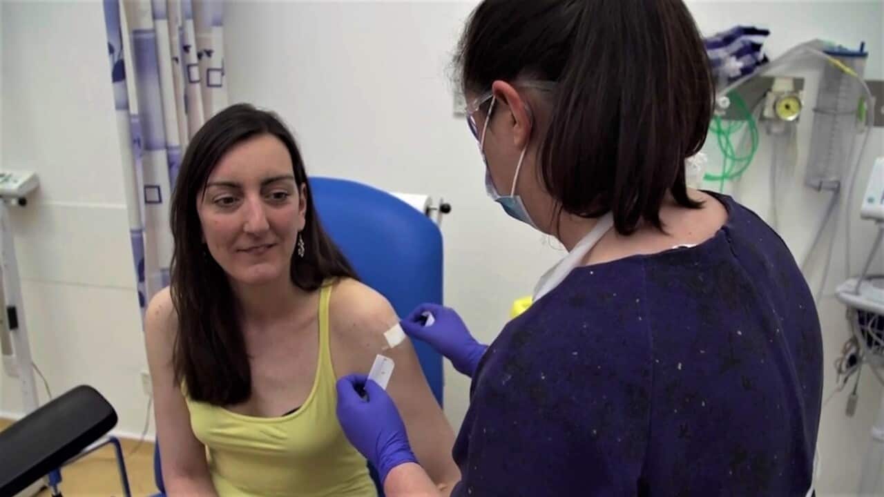 Microbiologist Elisa Granato, being injected as part of the UK trials for a potential coronavirus vaccine