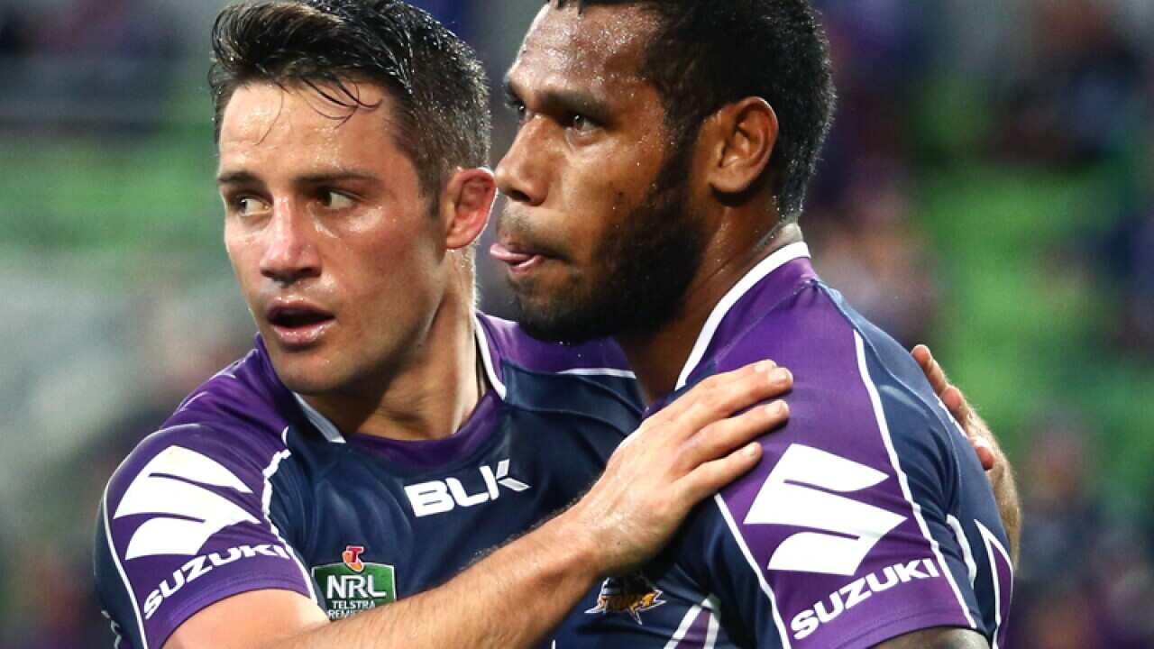 Cooper Cronk and Sisa Waqa celebrate a try .