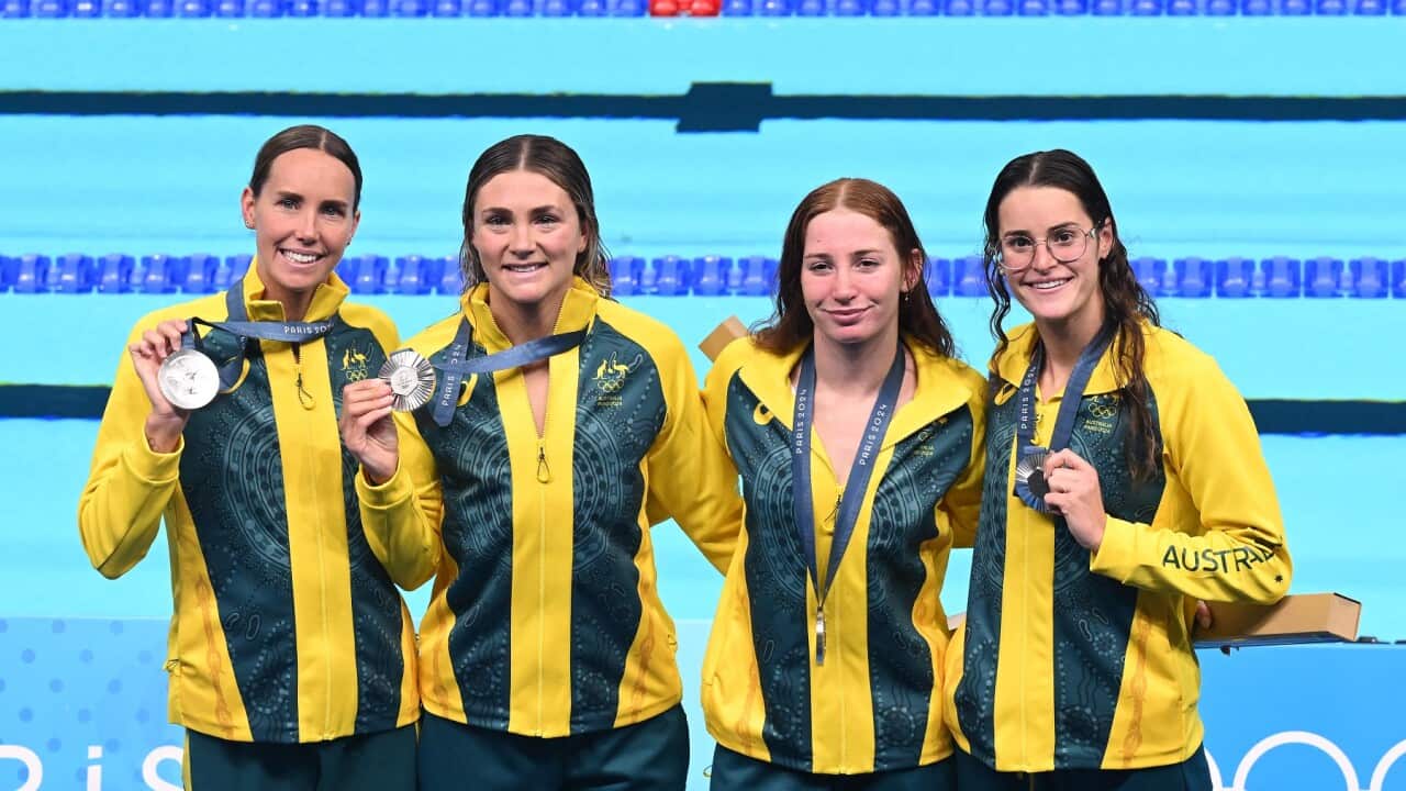 Emma McKeon, Jenna Strauch, Mollie O’Callaghan and Kaylee McKeown display their Olympic medals {AAP)
