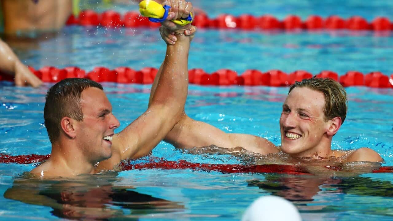 Kyle Chalmers of Australia (L) and Mack Horton of Australia embrace following the Men's 200m Freestyle Final 