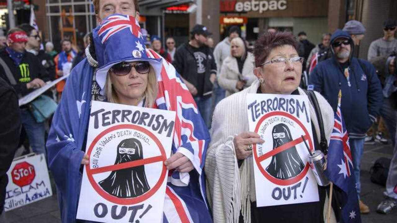 Anti-Islam signs are held as the Reclaim Australia movement held its Sydney rally on July 19, 2015. 