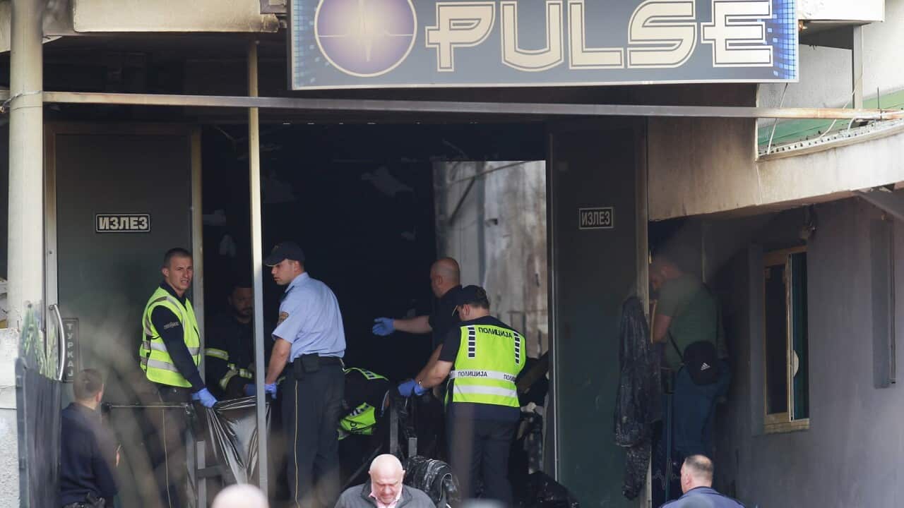 Police officers working at the site of the deadly fire at the nightclub in Kocani, North Macedonia (AAP)