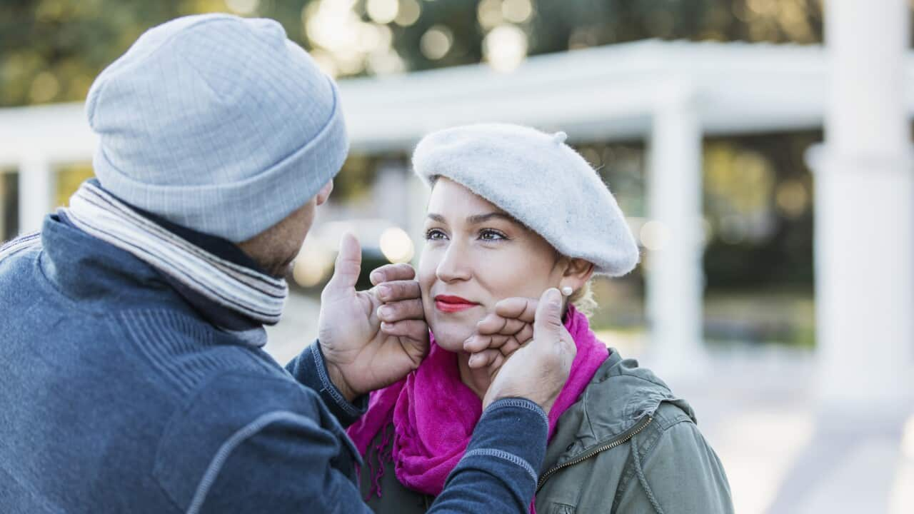 Affectionate couple look into each other's eyes.