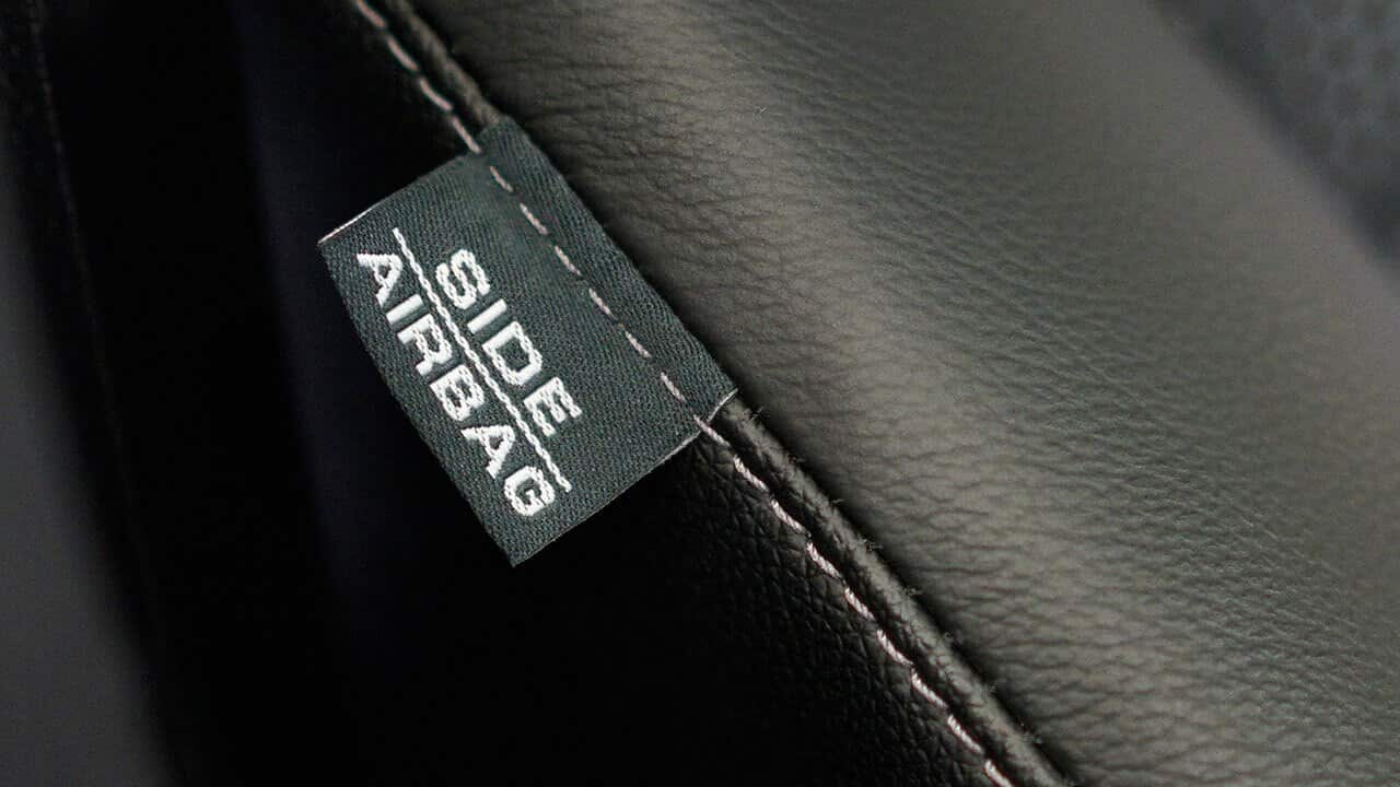 An Airbag tag is seen on a seat of a Honda vehicle 
