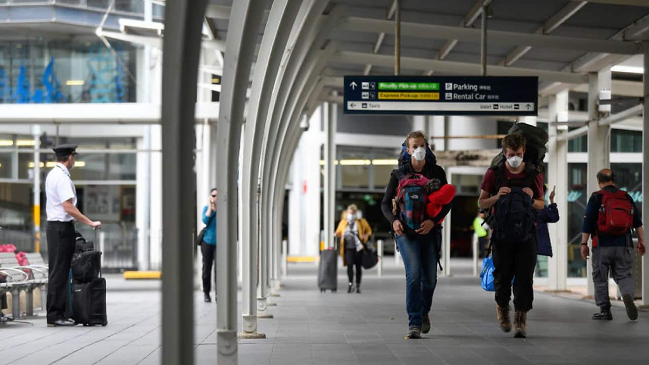 A file photo of travellers at Sydney Airport