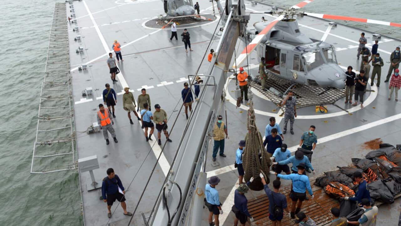 Indonesian's Navy prepare the dead bodies of AirAsia Flight 8501