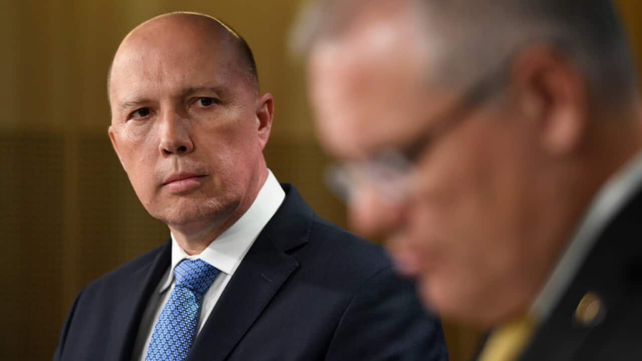 Minister for Home Affairs Peter Dutton (left) and Prime Minister Scott Morrison