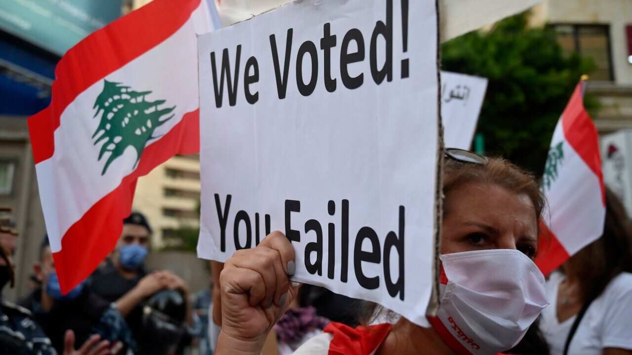 An anti-government protester in Lebanon calls for a new parliamentary election as the country plummets into economic disaster.