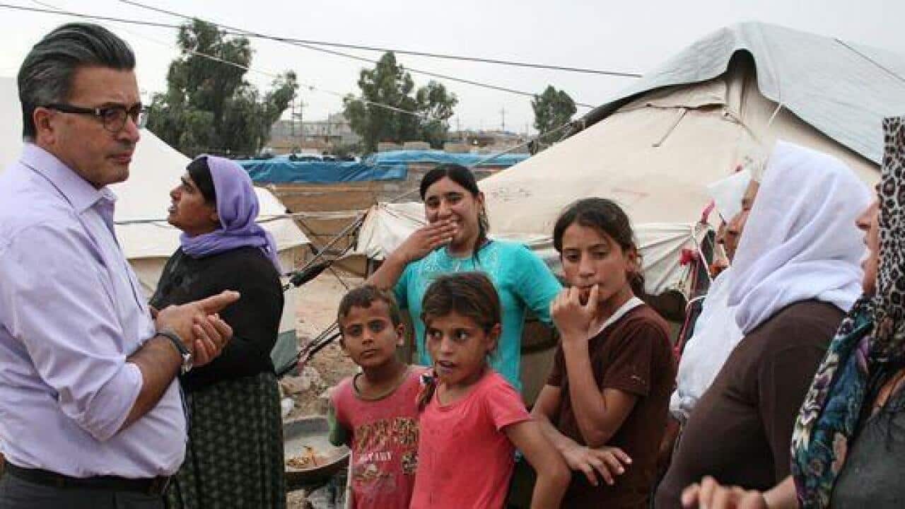 Dr Kizilhan with Yazidi refugees