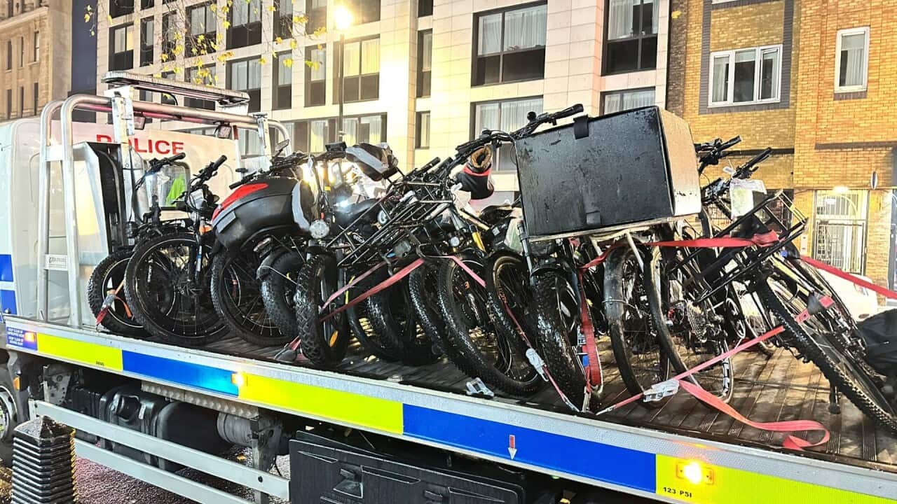 E-bikes stacked on a police vehicle.