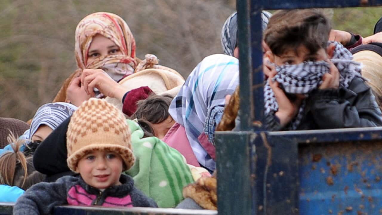 Some 1,000 Syrian refugees, including a defecting general, have crossed into Turkey, braving landmines laid to stop them by Syria's troops, Turkish officials said. (Getty)