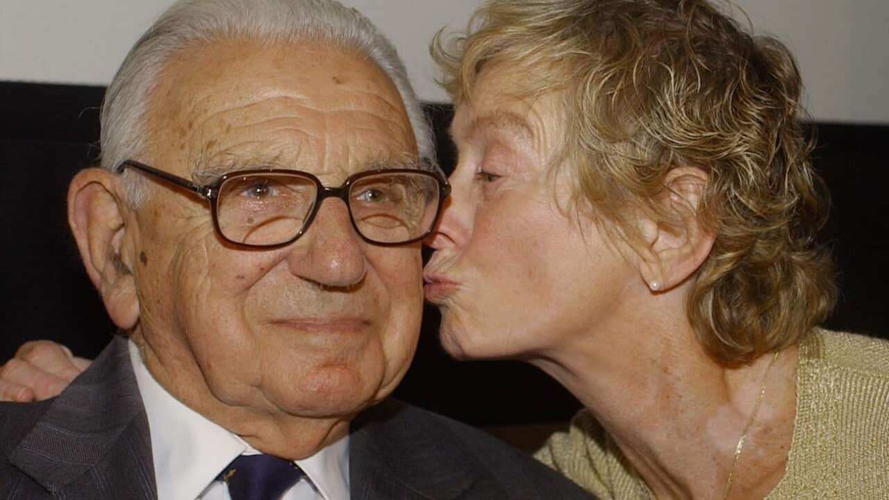 Sir Nicholas Winton as he gets a kiss on the cheek from Vera Gissingaged 74, who as an 11 year-old was helped by Sir Nicholas to escape Prague before the second World Wa (John Stillwell/PA Wire)