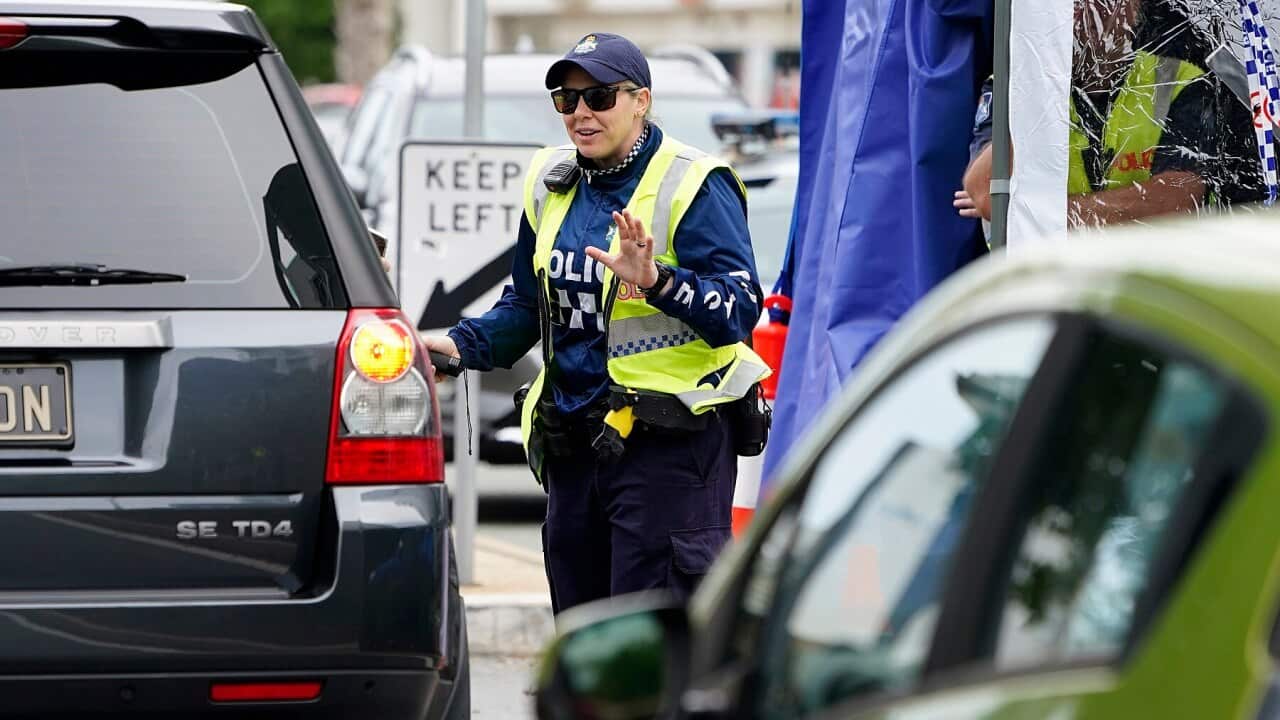 A Queensland police officer at a checkpoint at Coolangatta on the Queensland-New South Wales border