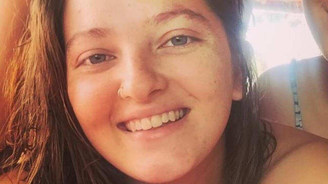 The bodies of 22-year-old Amelia Blake and another man in his 30s were discovered at a Newtown unit.