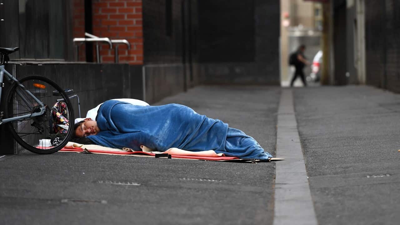 A homeless man sleeps in a laneway in Melbourne in March 2020