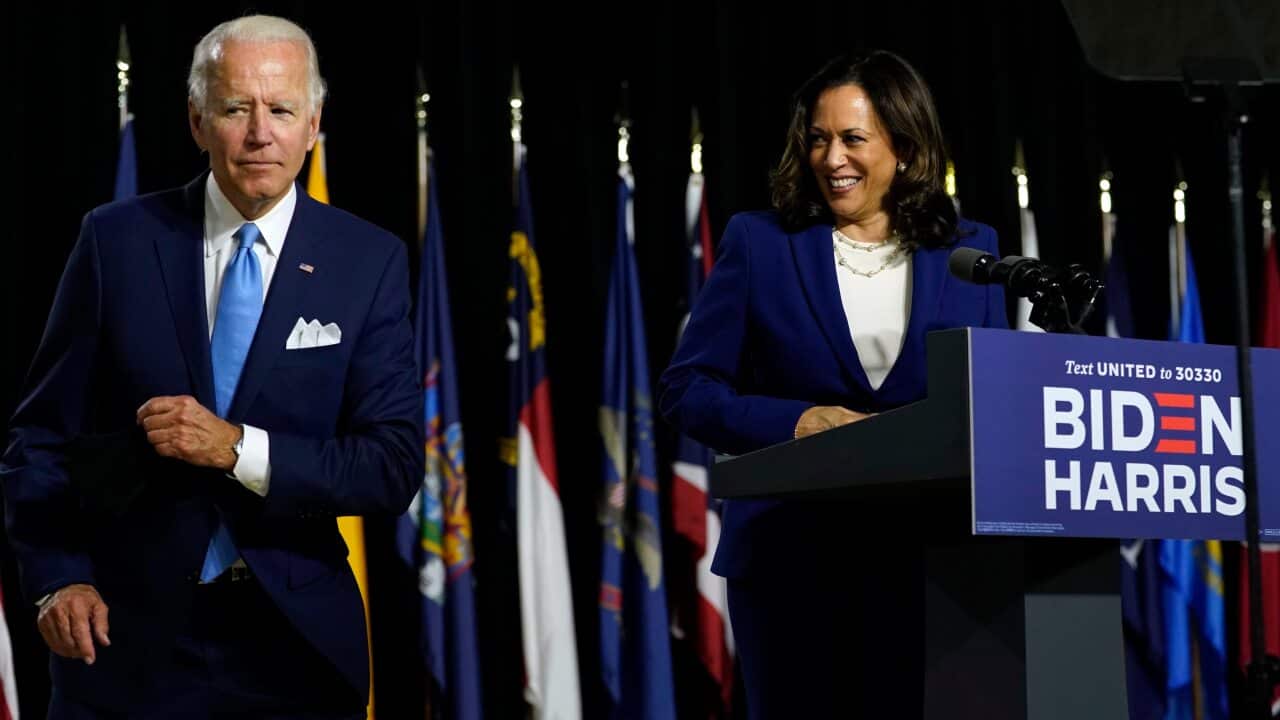 Democratic presidential candidate Joe Biden and his running mate Kamala Harris speak together at Alexis Dupont High School.