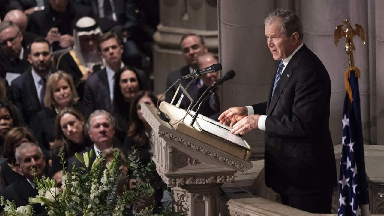 Former US President George W Bush provides a eulogy at the state funeral service for his father.