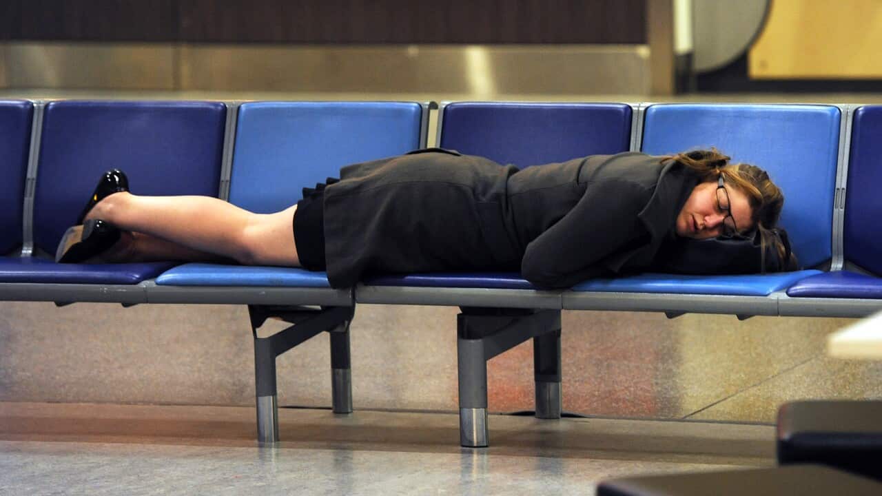A woman sleeps on a row of sleeps