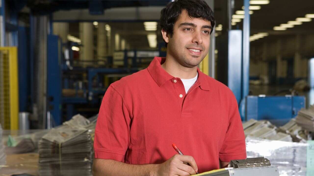 Man working in newspaper factory