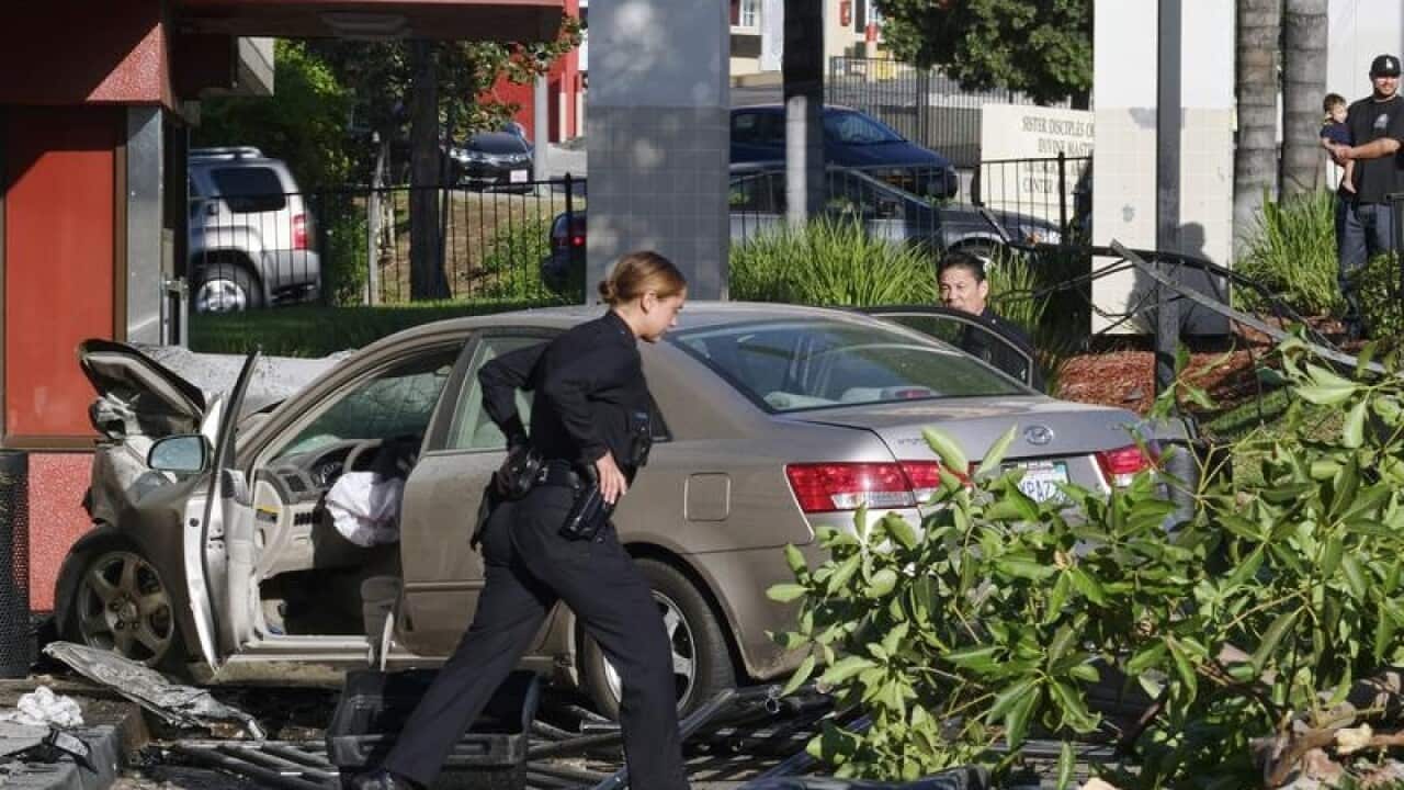 Police officers assess an accident.