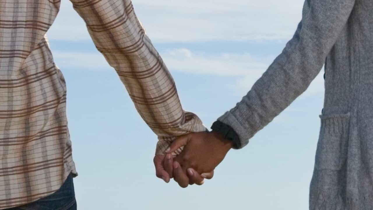 Couple holding hands