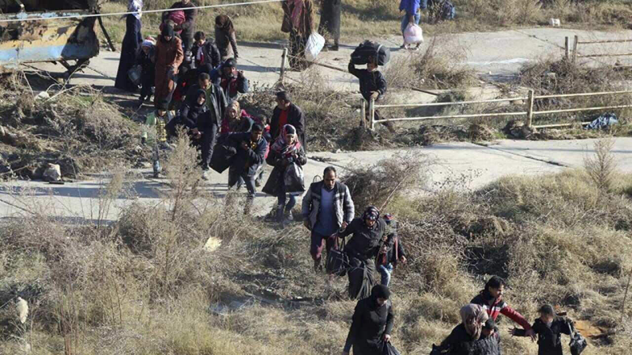 People fleeing rebel-held eastern neighbourhoods of Aleppo