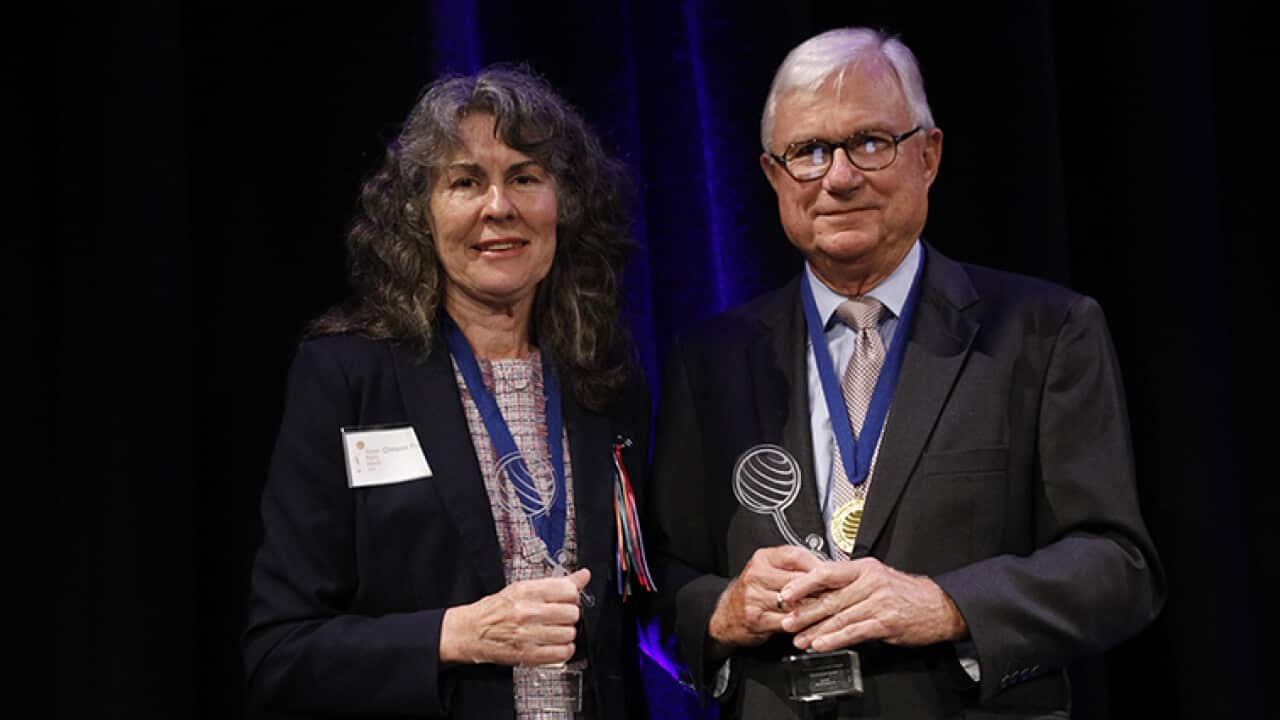 Justice Peter McClellan and Chrissie Foster receive their awards.