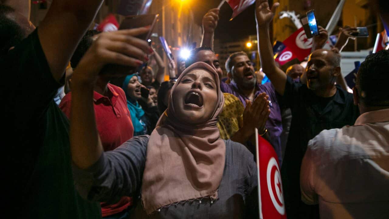 Supporters of the Islamist party Ennahda react as they follow exit polls in Tunis, Tunisia, Sunday, Oct. 6, 2019.
