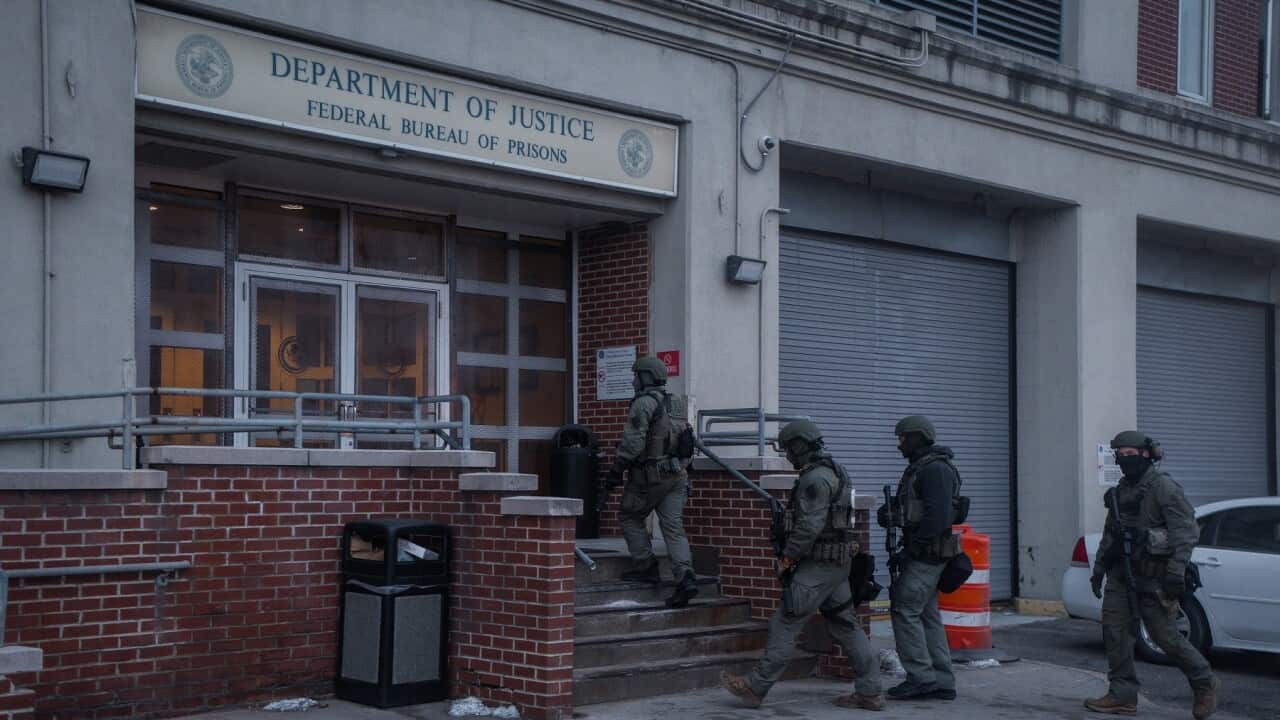 Federal law enforcement officers patrol outside the Metropolitan Detention Center, where Nicolas Maduro of Venezuela is being held in New York (AAP).