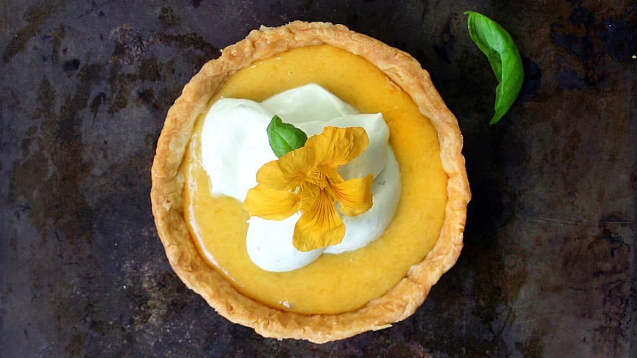 Peach curd and rosewater tartlets with basil whipped cream and nasturtium flowers 