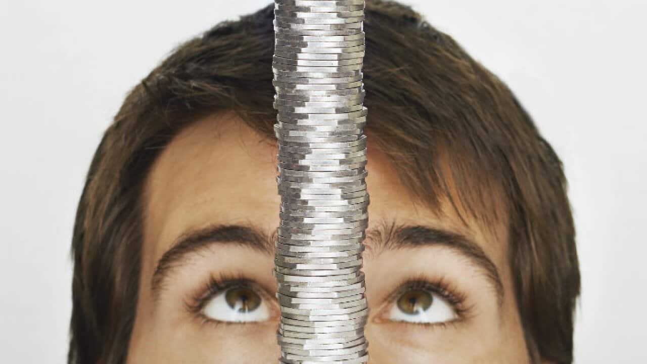 Man looking at coins